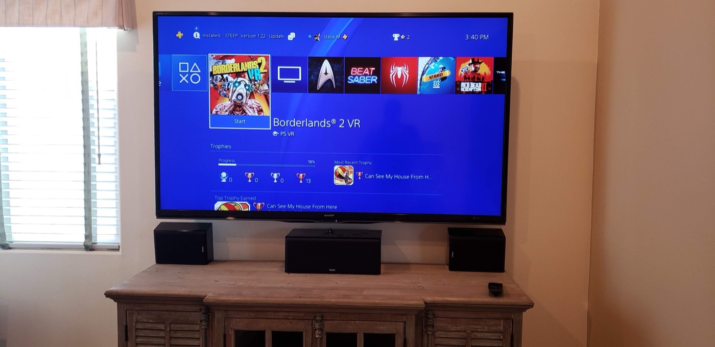 Home theater installation with tower speakers and a center channel